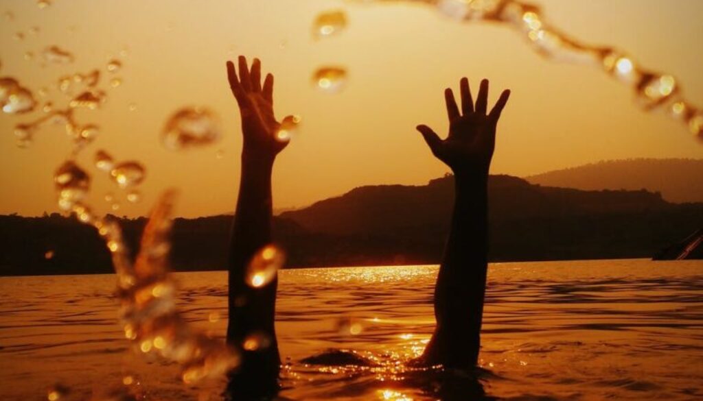 hands above water